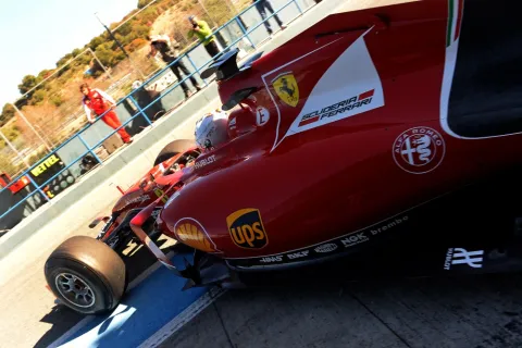 Sebastian Vettel now with white helmet in red car