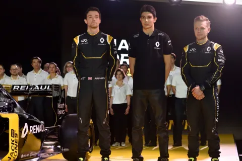The driver: Jolyon Palmer (left), test driver Esteban Ocon and Kevin Magnussen (right)