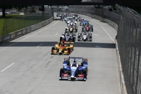 Takuma Sato leads the field at the start in race 2